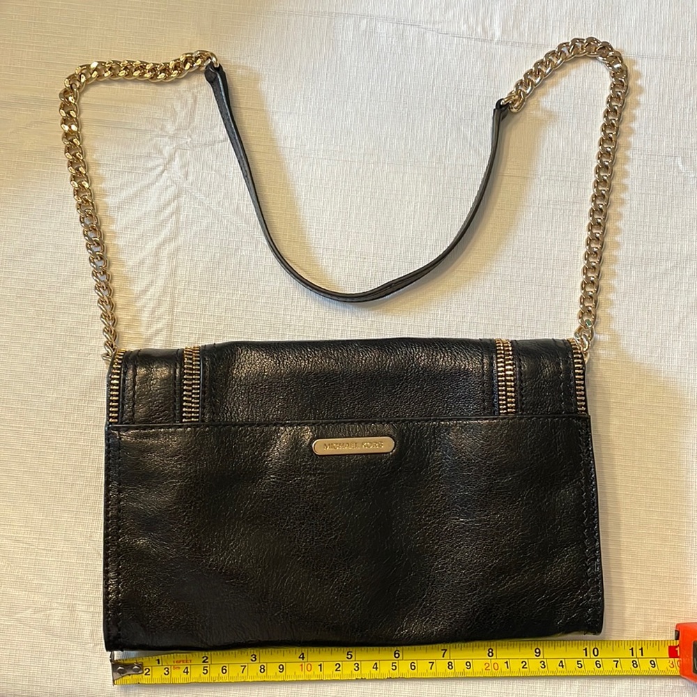 Michael Kors black leather with gold zippers and shoulder strap
